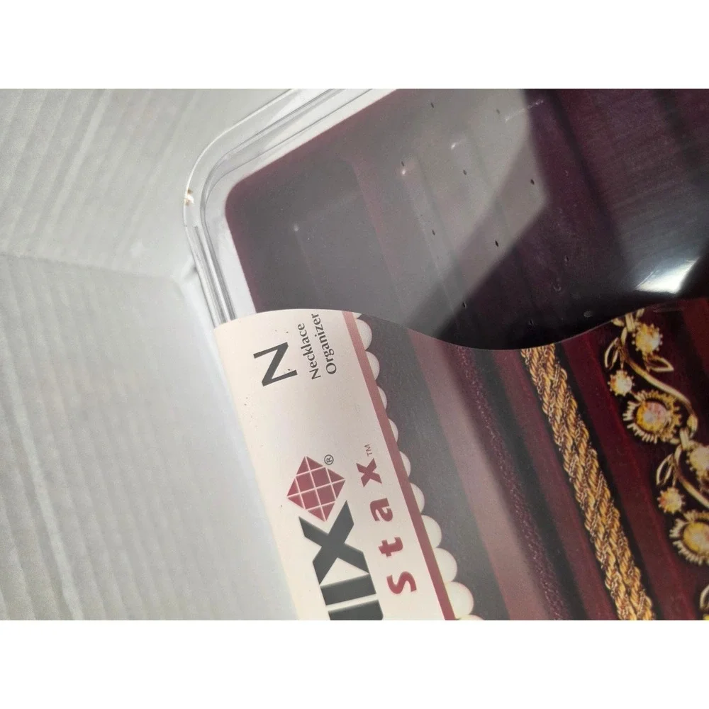 Neatnix Jewelry Stax necklace organizer tray featuring a burgundy red velvet